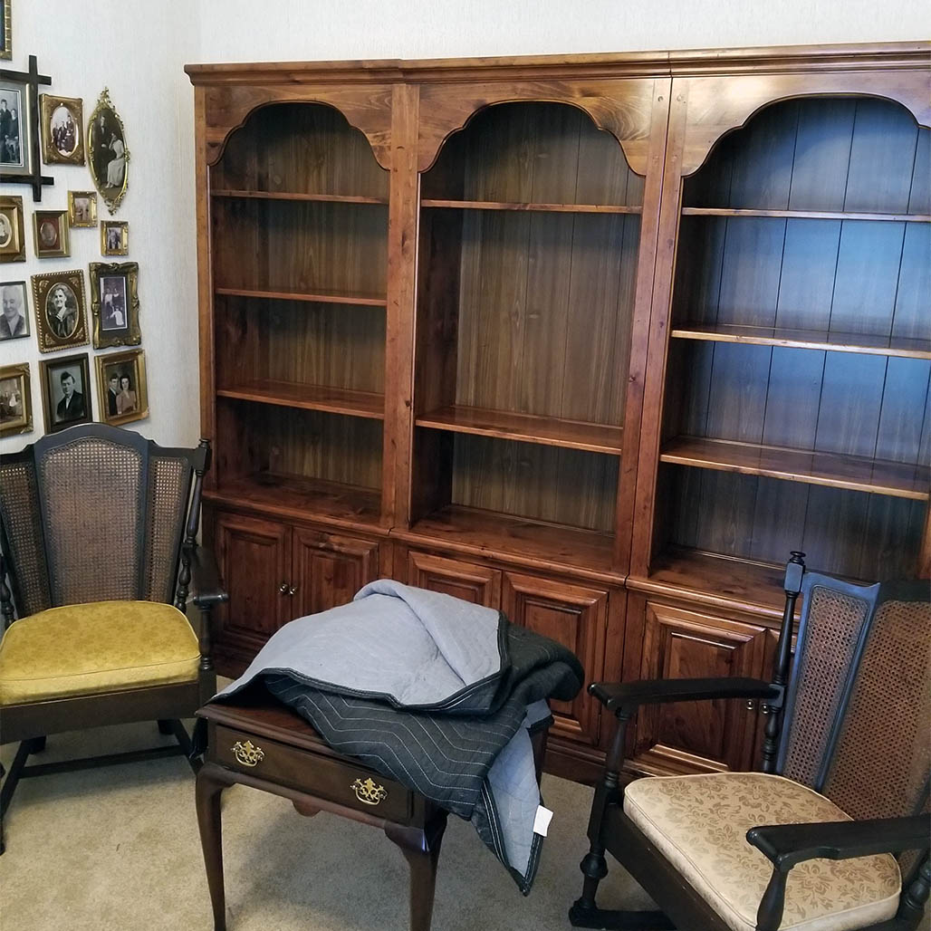 Large bookshelf and antique rocking chairs moved by Speeding Movers in Moline IL